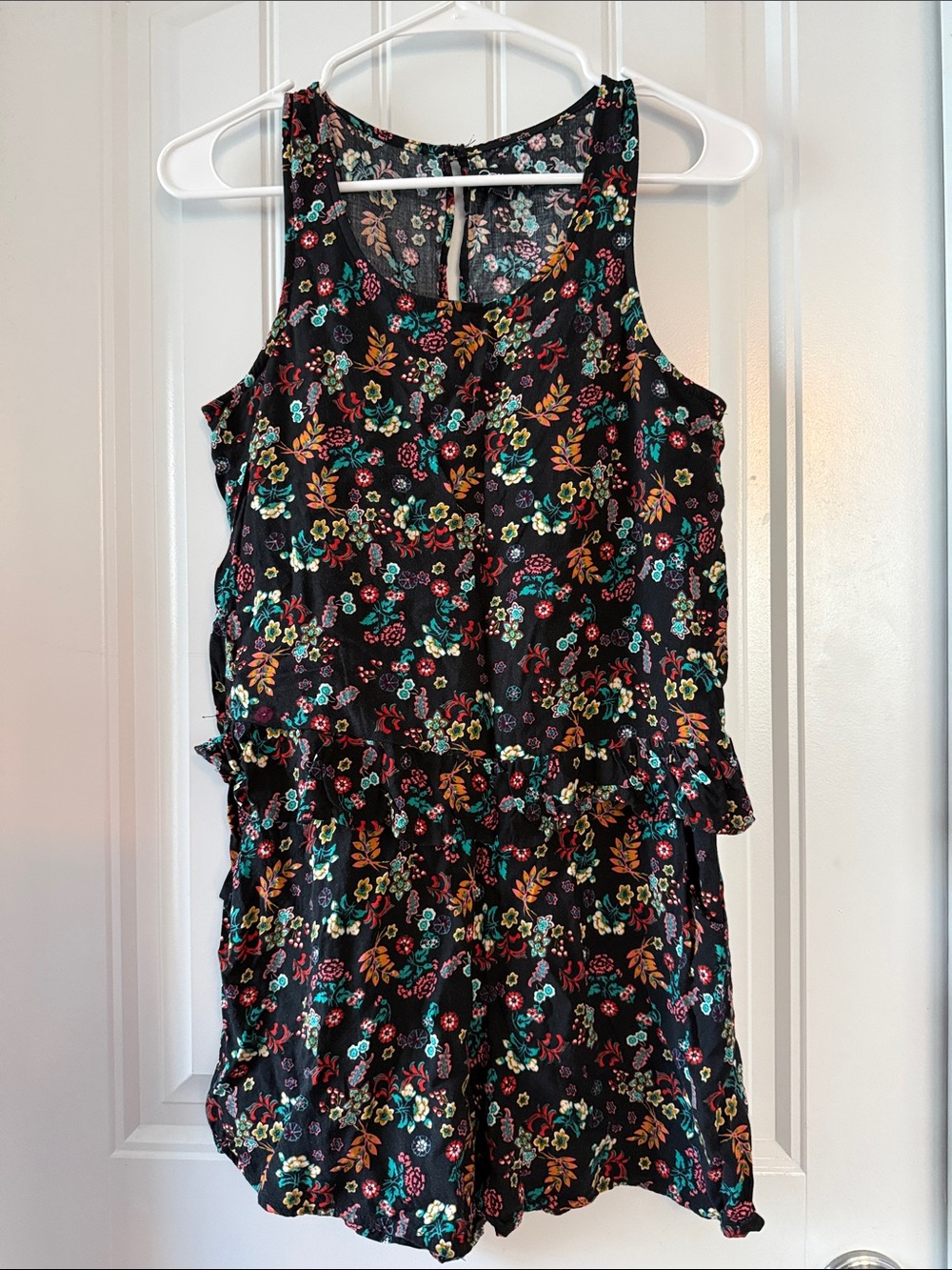 Gently worn Black Floral Ruffled Waist Sleeveless Romper